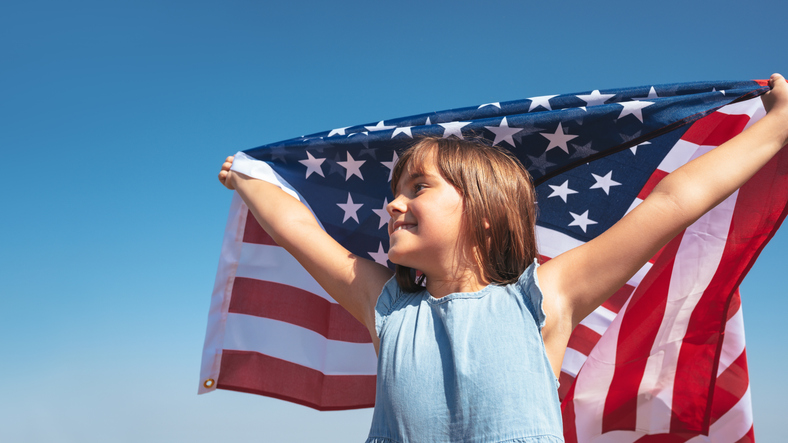 child holding American flag